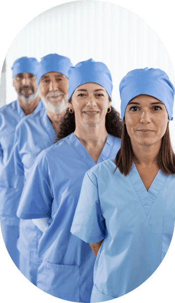 Medical professionals in blue scrubs standing together